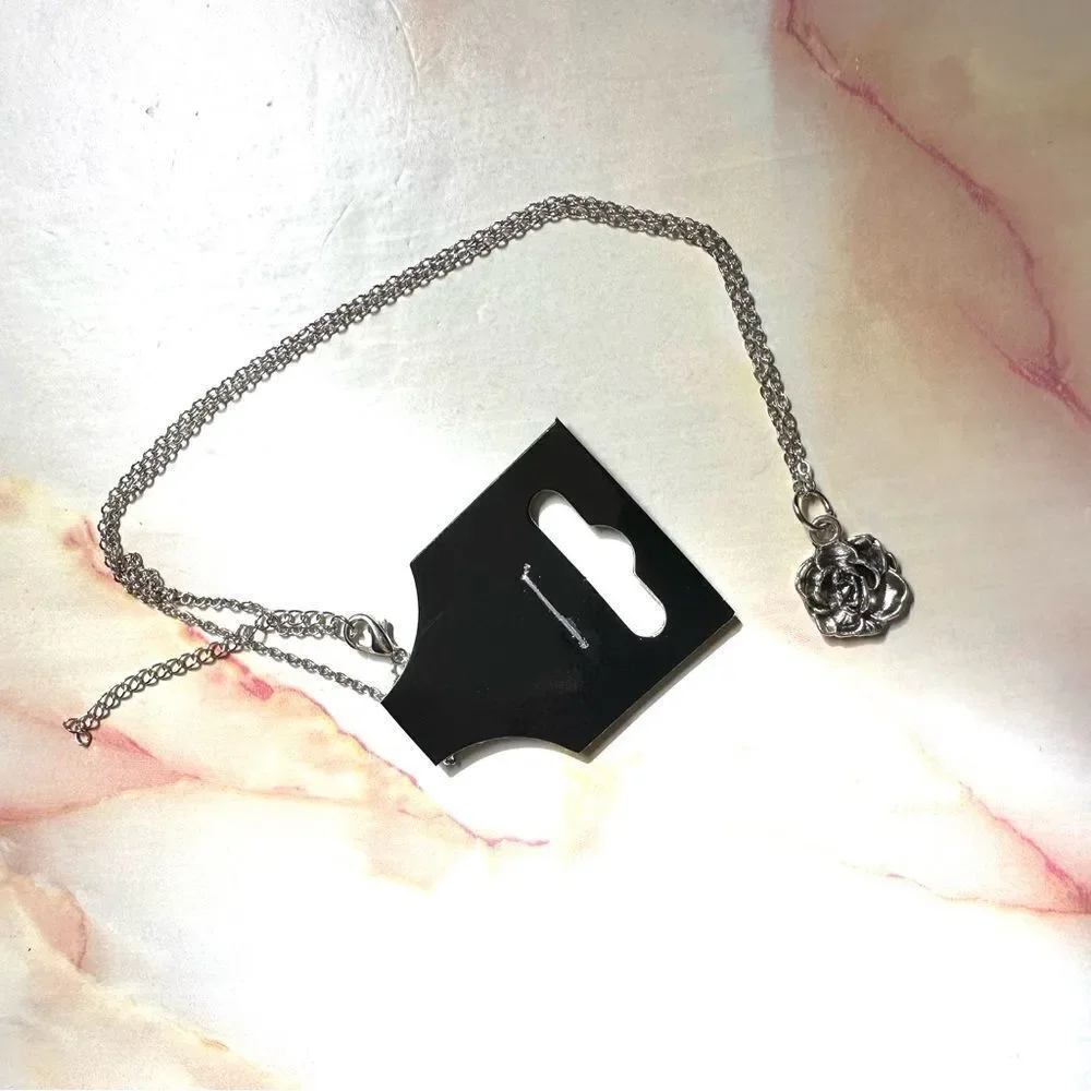 Silver tone rose pendant necklace